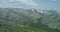 Green forest among the red mountains in the Magadan region.