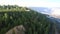 Green forestry slope with observation deck at asbestos pit