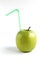Green fresh apple with tubule, isolated on white background. Vegan lifestile concept