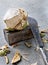 Green fresh coconut peeling with heavy chop knife on wooden cutting board for juice.