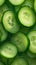 Green freshness backdrop Slices of cucumber backlit for texture