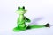 Green frog figure doing meditation and stretching his leg