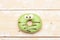 Green funny surprised donut