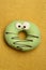 Green funny surprised donut