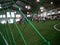 Green futsal net with background blur futsal player at morning