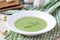 Green garlic cream soup with leaves rukola, arugula, healthy