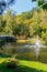 The green glade on the shore of the pond is a great place to relax with a beautiful view of the fountain in the middle