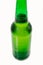green glass bottle covered with water drops. condensate