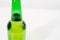 green glass bottle covered with water drops. condensate