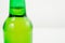 green glass bottle covered with water drops. condensate