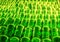 Green glass bottles stacked in rows for drying. Production of glass containers for beer