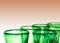 Green glass designer wine glasses detail view abstract with copy space