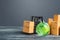 Green glass globe and forklift truck with cardboard boxes. Distribution and trade exchange goods around the world, retail