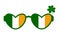 Green glasses with a three-leaf clover and the coloring of the Irish flag. St. Patrick's Day symbol and