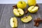 Green golden apples or Granny smith with cinnamon sticks on wooden background, preparing food, dessert