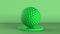 Green golf ball on green background