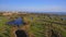 Green golf courses by the sea. Salgados beach. Portugal, Albufeira. Aerial view.