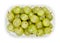 Green gooseberries, European gooseberries, in a plastic container