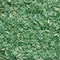 Green granules of polypropylene or polyamide. background. Plastics and polymers industry.