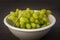 Green grapes in a bowl, juicy and delicious
