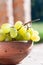 Green grapes in a bowl in the sunlight