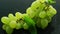 Green grapes on wet table