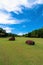Green grass Fairway Golf Course and Large Rocks with beautiful Blue Sky