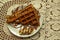 Green grass in the morning dew, beautiful summer background in the open air. Green herbal background.Waffle cake with chocolate an