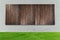 Green grass with white concrete and wood fences