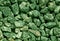 Green gravel pile texture.