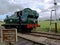 Green GWR Panier Tank steam engine and driver Somerset England 