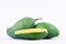 Green half mango peeled and two fresh green mangoes on white background healthy fruit food isolated