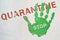 Green handprint with the inscription STOP on the inscription QUARANTINE. End of quarantine, reduction of viral hazard