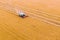 Green harvester harvests wheat  drone photography