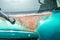 Green hatchback car back or fifth door damaged rusty and corroded paint spots