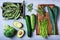 Green healthy cooking ingredients, clean eating, vegetarian protein on grey.
