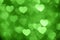 Green heart bokeh background photo, abstract holiday backdrop