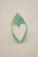 Green heart leaves on wood floor