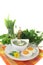 Green herb soup with eggs and a dollop of cream