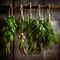 green herbs hanging from a rope