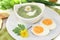 Green herbs soup with eggs