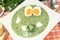 Green herbs soup with eggs