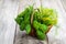 Green herbs in wicker basket