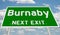 Green highway sign for Burnaby next exit