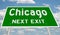 Green highway sign for Chicago next exit