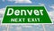 Green highway sign for Denver next exit