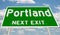 Green highway sign for Portland next exit