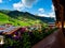 Green hills of an alpine resort in Austria in summer. Small village, hotels and chalets, all in colors. Beautiful terraces and