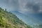 Green hills landscape view at the mountains during cloudy day in Himalayas