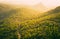 Green hills and mountain landscape at sunset lights